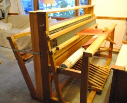 The large floor loom, upon which many weavings are created.